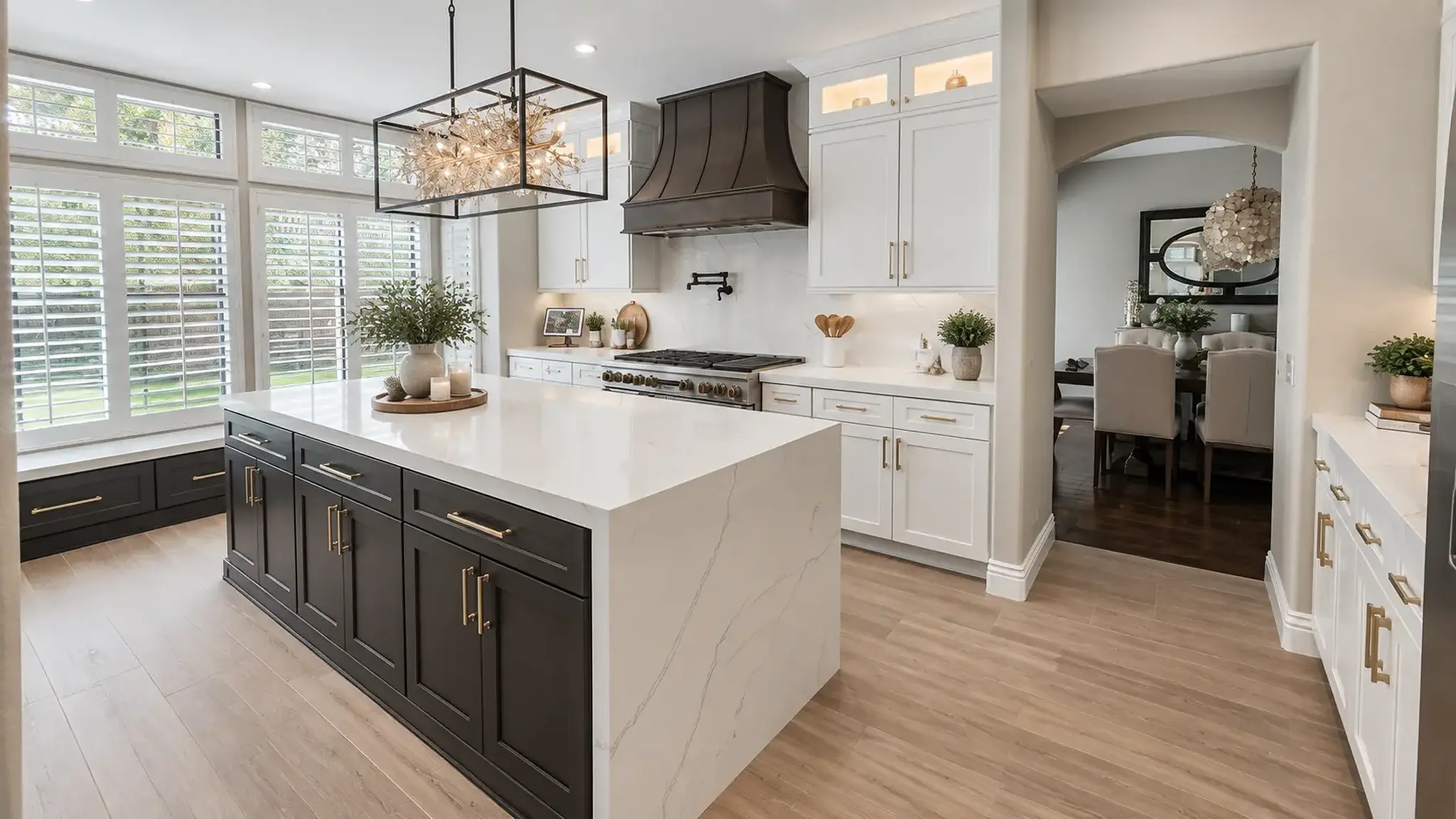 Contemporary Southern California kitchen remodel with white cabinetry, a dark wood island, waterfall countertops, and custom lighting